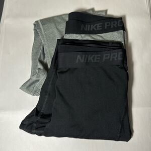 Nike pro full length leggings. 2 pairs. One grey and one black. Size medium.